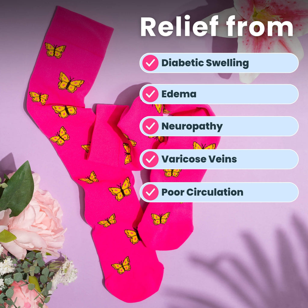 pink compression socks a with butterfly pattern with flowers flatlay