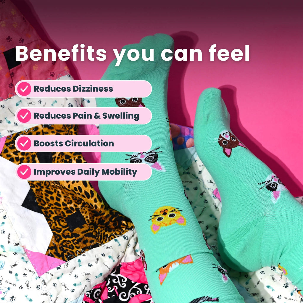 Legs wearing light green knee high compression socks with cat design