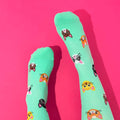 Light green knee high compression socks with cat design.
