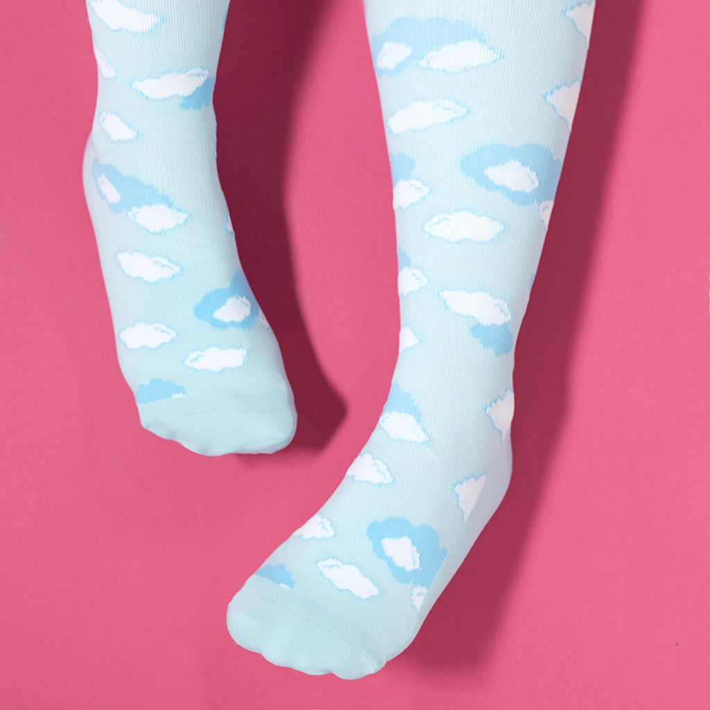 Light blue compression socks with cloud pattern