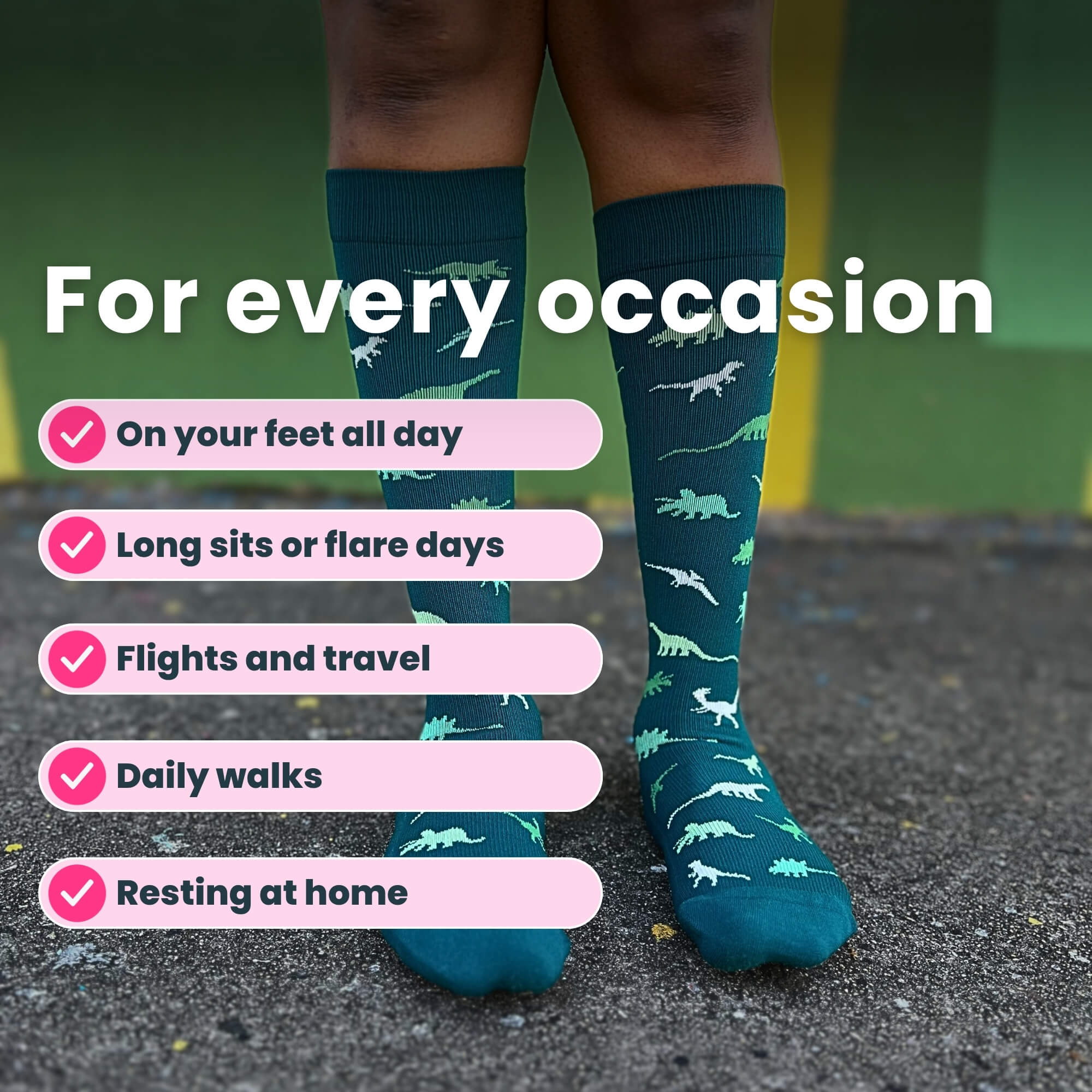 Legs close up wearing green compression socks with a dinosaur pattern