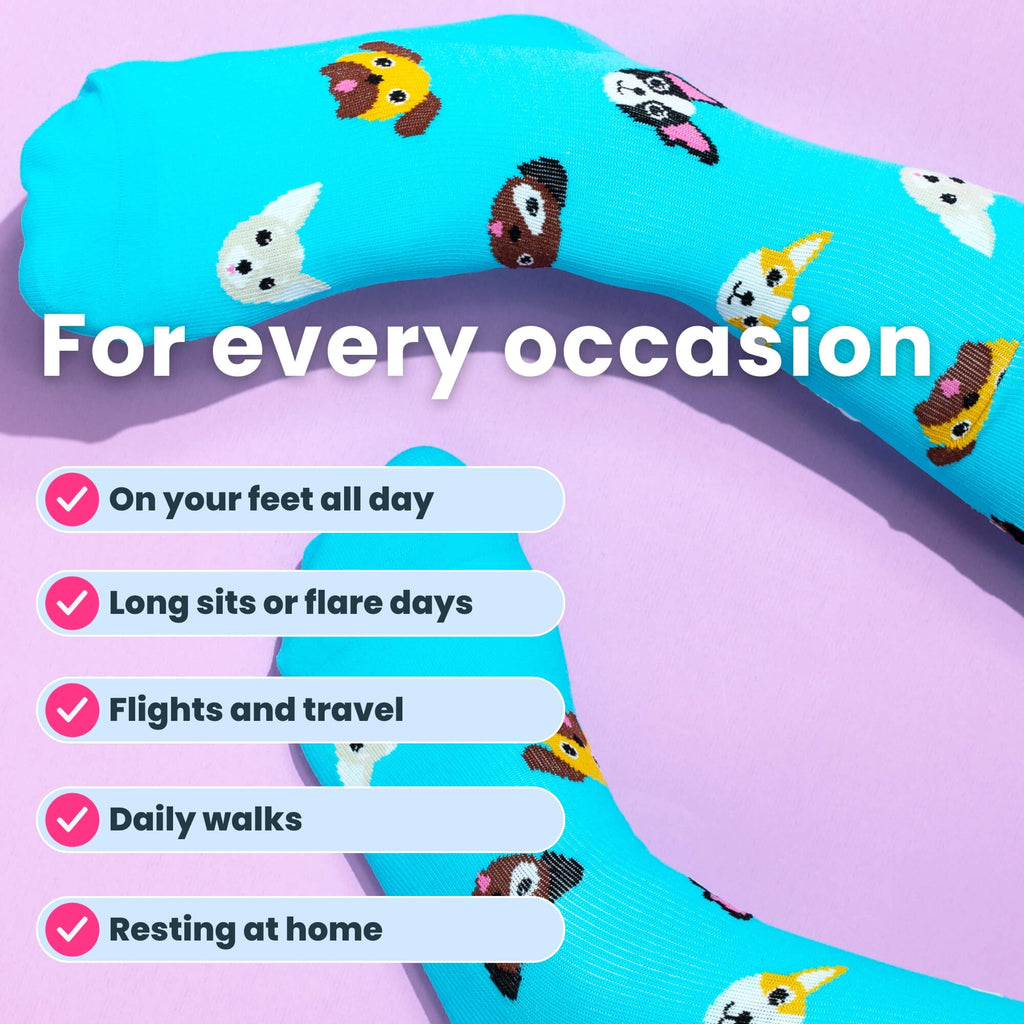 Blue knee-high compression socks with dog patterns on feet