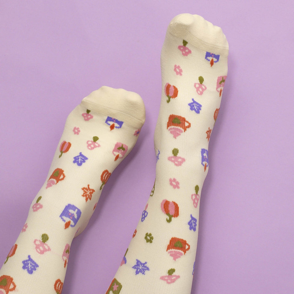Beige compression socks with pumpkin spice pattern