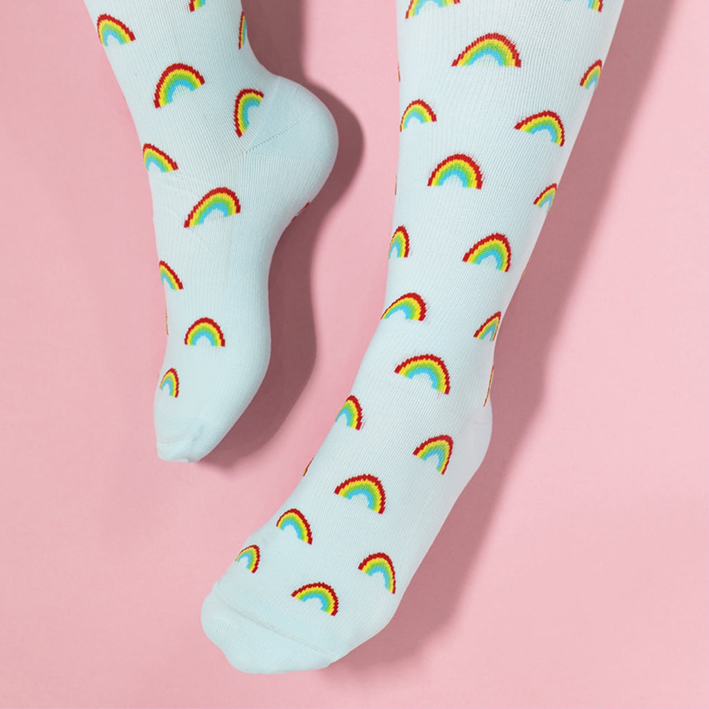 Light blue compression socks with rainbow patterns 