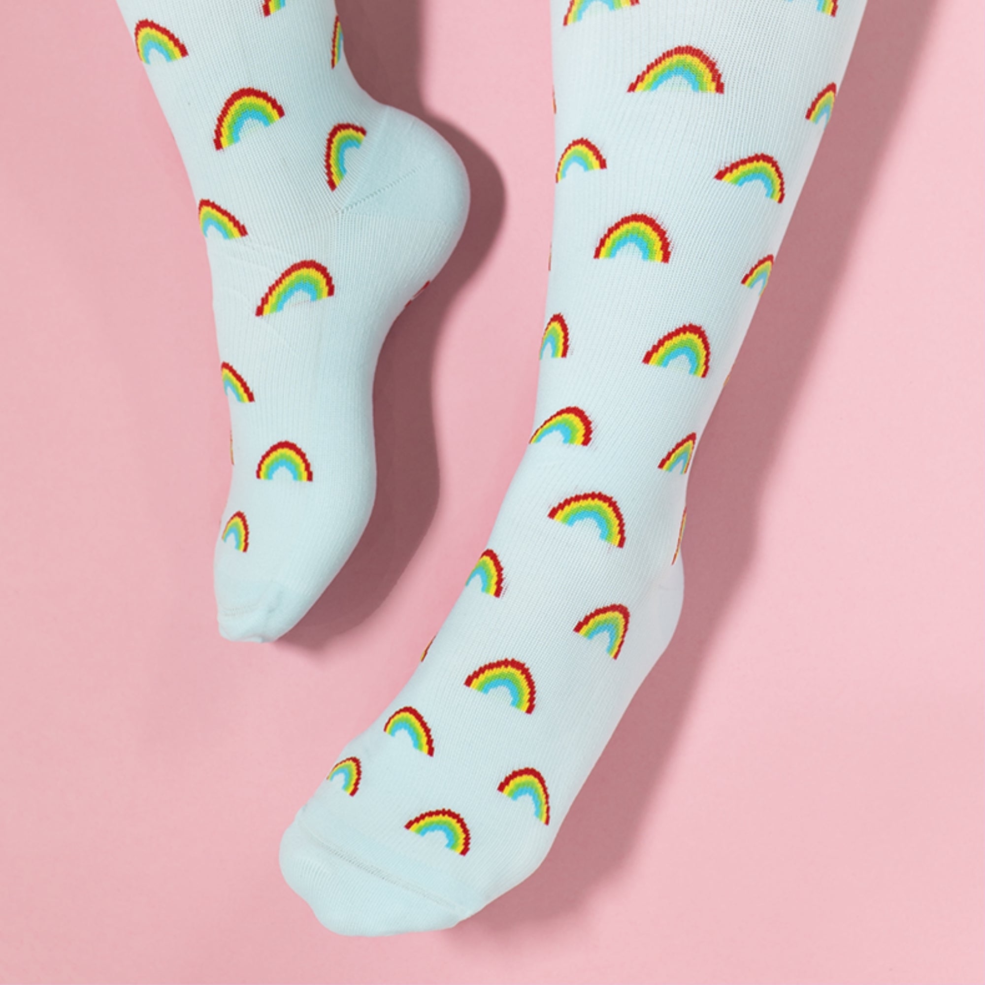 Light blue compression socks with rainbow patterns 