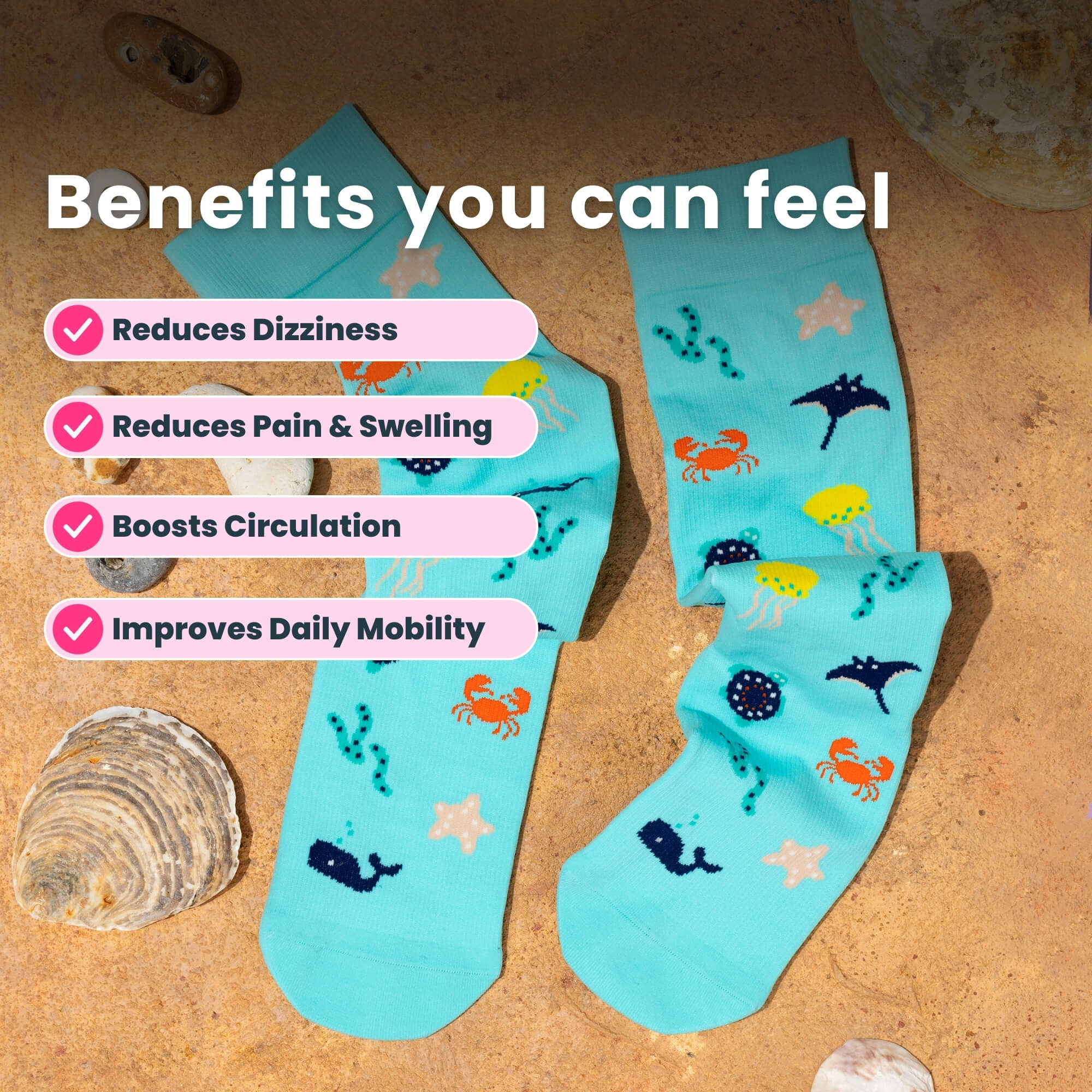Teal compression socks with sea themed patterns sand and coarl background