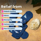 Navy blue compression socks with shark pattern on sand backdrop