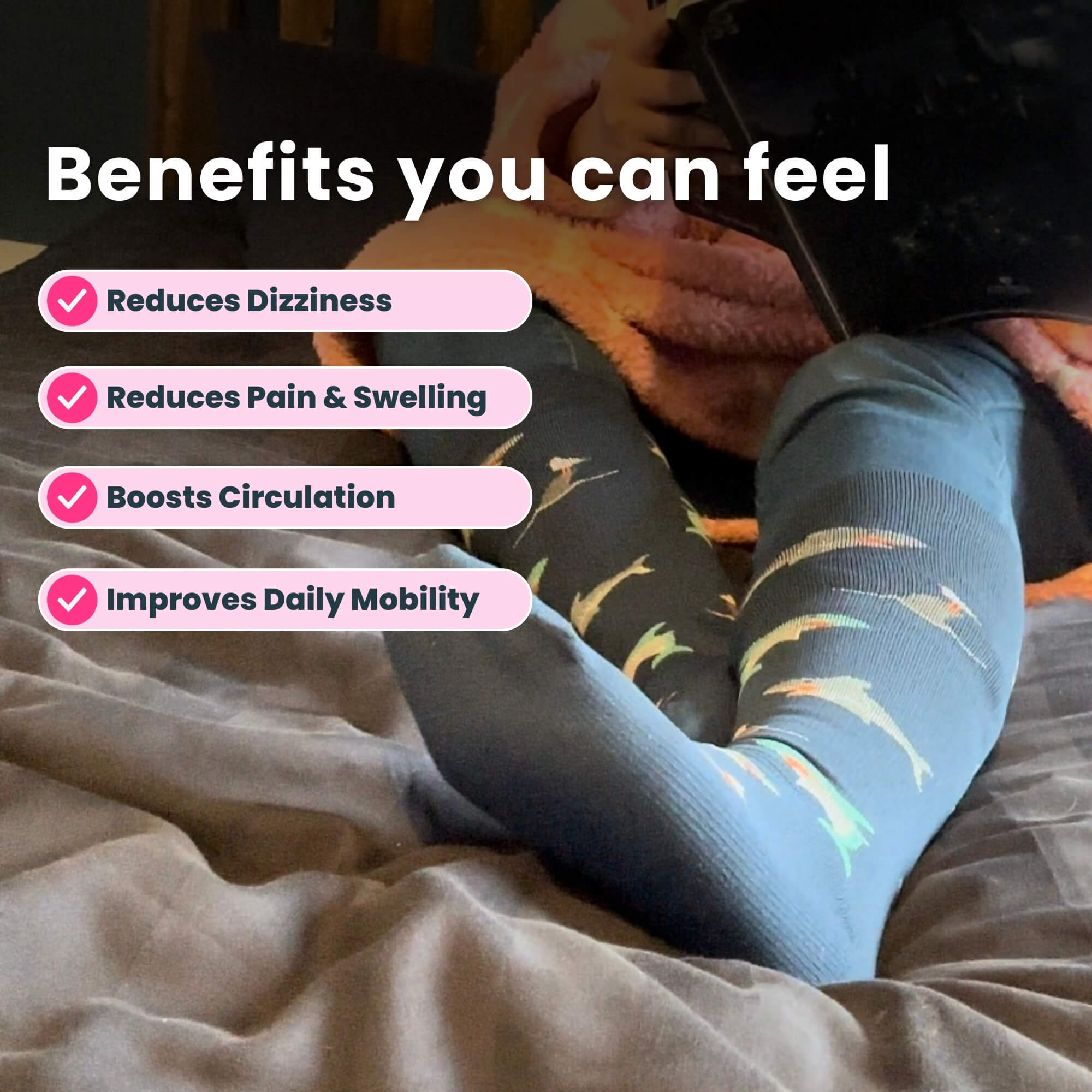 woman on bed wearing navy blue compression socks with shark pattern